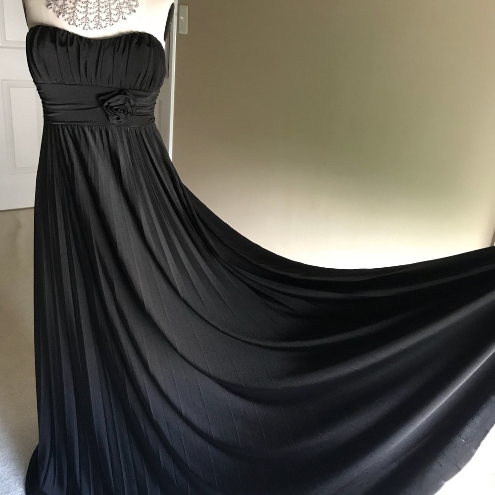 Woman’s black strapless gown